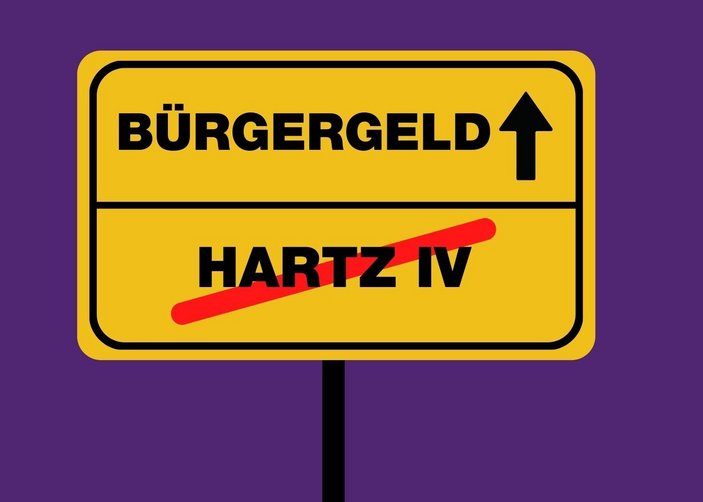 Illustration eines Straßenschildes mit dem durchgestrichenen Wort "Hartz IV" und dem neuen Wort "Bürgergeld"